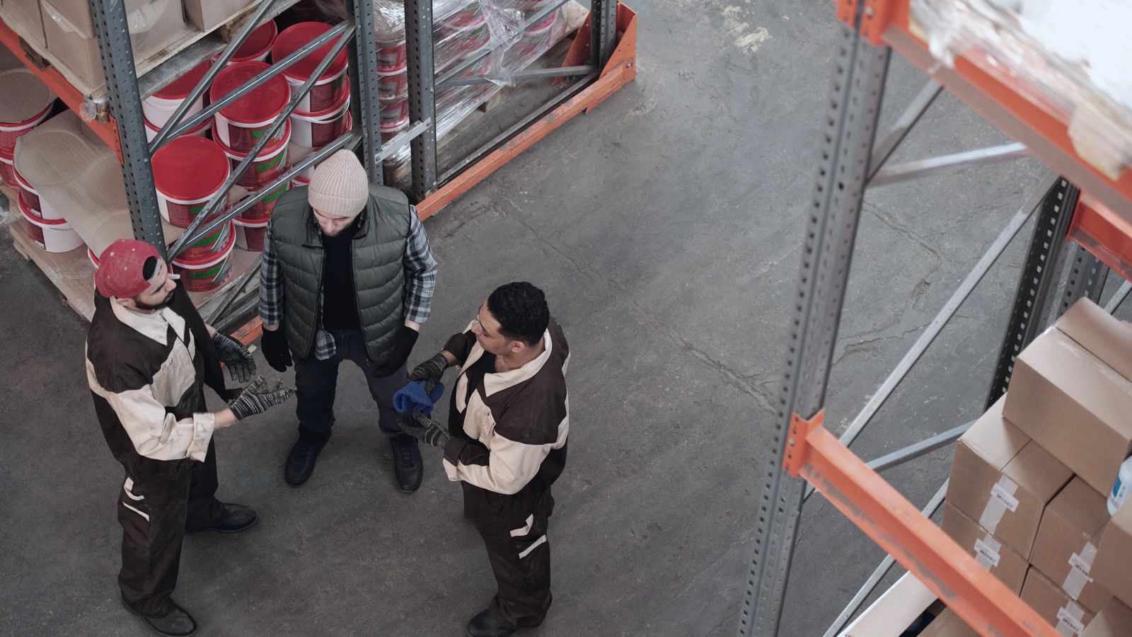 Two people talking on a factory floor