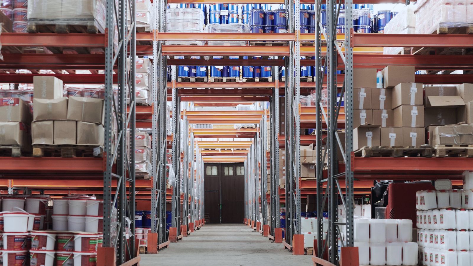 Warehouse aisle with stocked racks